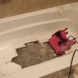 Samuel cut out bottom portion and removed foam and other material from tub prior to applying concrete. Samuel cut out bottom portion and removed foam and other material from tub prior to applying concrete.