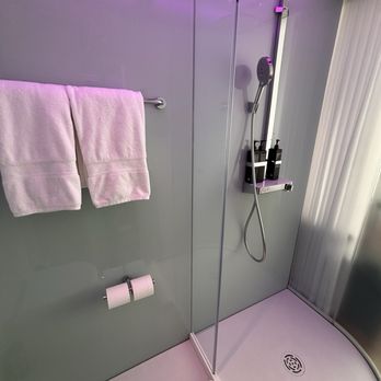 citizenM Seattle Pioneer Square - Shower with wand and rain heads. Shower lights are customizable via the iPad. - Hotels Near Me - Seattle, Washington