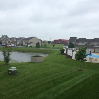 Watersedge Apartments - The lake and the clubhouse swimming pool which is the view from many apartments. - Apartments Near Me - Champaign, Illinois Watersedge Apartments - The lake and the clubhouse swimming pool which is the view from many apartments. - Apartments Near Me - Champaign, Illinois