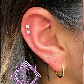 Metropolis Tattoo & Piercing - Helix piercings by Steven - Tattoo Near Me - San Diego, California Metropolis Tattoo & Piercing - Helix piercings by Steven - Tattoo Near Me - San Diego, California