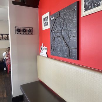Le Crepe - a red wall with a map on it - Creperies Near Me - Royal Oak, Michigan