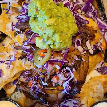 Blackmoor Bar and Kitchen - Nachos with Pulled Pork lime crema on the side - American Near Me - Boston, Massachusetts
