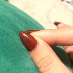 The polish is on my skin all around on most on my nails.
