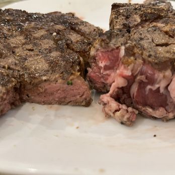 Stripsteak - My sad rib eye steak on left- my husband's rib eye. - Steakhouses Near Me - Honolulu, Hawaii Stripsteak - My sad rib eye steak on left- my husband's rib eye. - Steakhouses Near Me - Honolulu, Hawaii