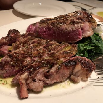 Kokkari Estiatorio - Mosharisia Brizola - Charcoal Grilled Dry-Aged Ribeye with Braised Greens and Kokkari Potatoes - Greek Near Me - San Francisco, California Kokkari Estiatorio - Mosharisia Brizola - Charcoal Grilled Dry-Aged Ribeye with Braised Greens and Kokkari Potatoes - Greek Near Me - San Francisco, California
