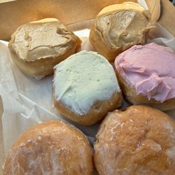 Caramel topped donut, strawberry topped donut, cream cheese topped donut, raspberry filled donut
