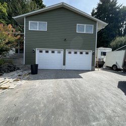 All Phase Construction - New siding and garage doors.