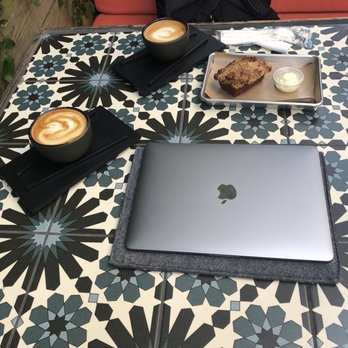 Siphon Coffee - Lattes and banana bread on the patio. - Cafes Near Me - Houston, Texas