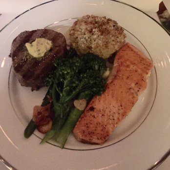 Lisa D Personal Chef - Main course of Filet Mignon and Steelhead Salmon, accompanied by Potato Au Gratin and broccollini. - Personal Chefs Near Me Lisa D Personal Chef - Main course of Filet Mignon and Steelhead Salmon, accompanied by Potato Au Gratin and broccollini. - Personal Chefs Near Me