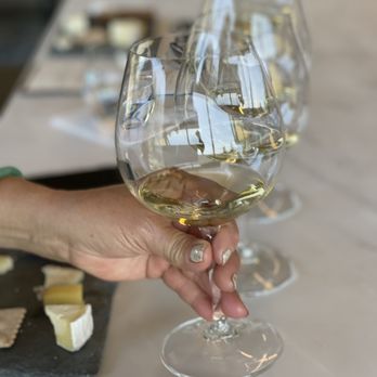 Gary Farrell Vineyards & Winery - a hand holding a wine glass - Wine Tours Near Me - Healdsburg, California Gary Farrell Vineyards & Winery - a hand holding a wine glass - Wine Tours Near Me - Healdsburg, California