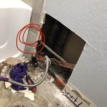 Copperfield Plumbing - Red circle shows where leak was: would have made it much easier on plumber to remove the tile but he worked hard to avoid damaging them! - Plumbing Near Me