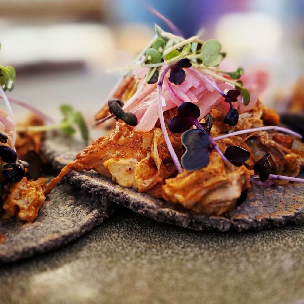Alejandro's - Conchinita Pibil Tacos Banana leaf wrapped pork with achiote and citrus - Mexican Near Me - Monterey, California Alejandro's - Conchinita Pibil Tacos Banana leaf wrapped pork with achiote and citrus - Mexican Near Me - Monterey, California