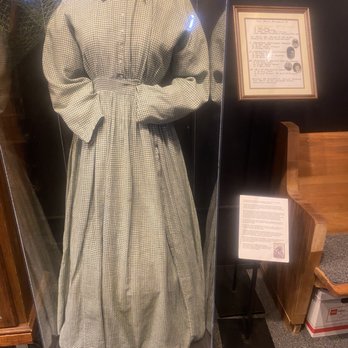 Baldwin County Heritage Museum - This dress was passed down to the first born daughter for three generations until there were not more daughters. So it was donated. - Museums Near Me - Elberta, Alabama Baldwin County Heritage Museum - This dress was passed down to the first born daughter for three generations until there were not more daughters. So it was donated. - Museums Near Me - Elberta, Alabama