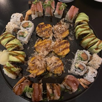 Takara 14 - Peridot roll (avocado on top), spicy salmon, onyx roll (tuna on top), and citrine roll (middle). - Japanese Near Me - Washington, DC, District of Columbia Takara 14 - Peridot roll (avocado on top), spicy salmon, onyx roll (tuna on top), and citrine roll (middle). - Japanese Near Me - Washington, DC, District of Columbia
