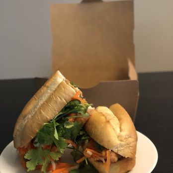 Saigon On 7th - Plated at home: Banh Mi sandwich with chicken on fresh french roll. Filled with pickled carrots, daikon, cilantro & spicy jalapeno - Vietnamese Near Me - Austin, Texas Saigon On 7th - Plated at home: Banh Mi sandwich with chicken on fresh french roll. Filled with pickled carrots, daikon, cilantro & spicy jalapeno - Vietnamese Near Me - Austin, Texas