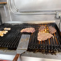 Tuesday's Bar & Grill - Our steak fry  T bone or New York strip Three large shrimp on the grill