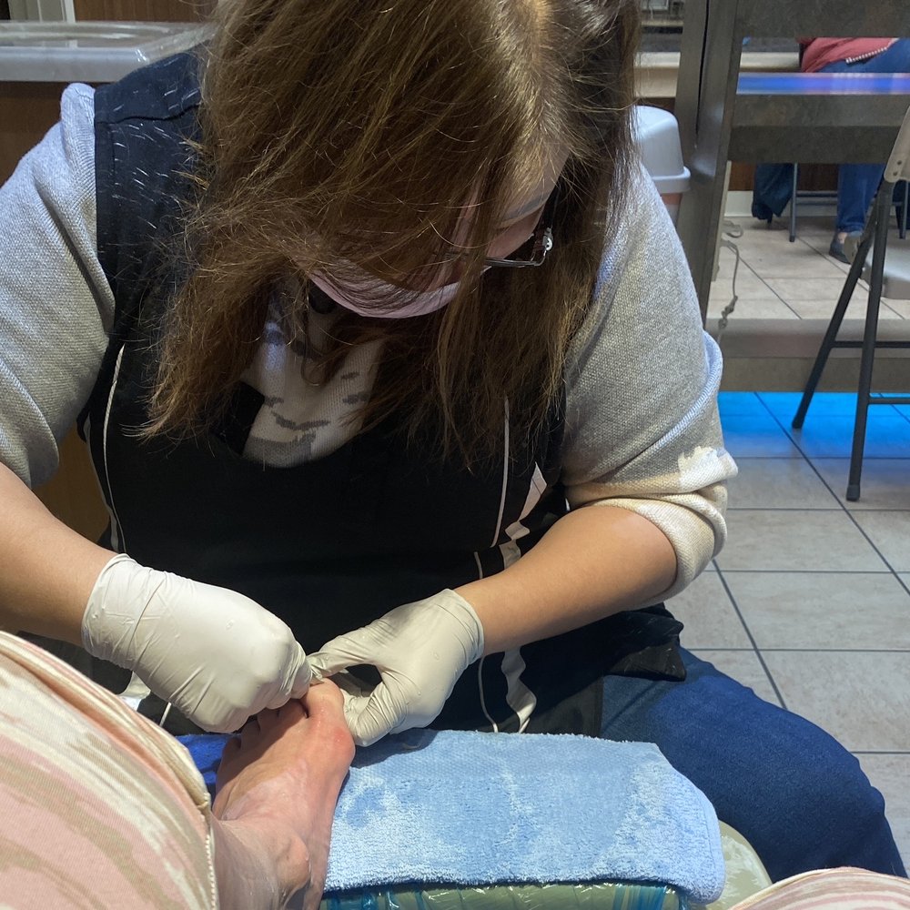 Elegant Nails - Woman talking about $19 dollars extra to scrub feet for pedicure - Nail Salons Near Me - Topeka, Kansas Elegant Nails - Woman talking about $19 dollars extra to scrub feet for pedicure - Nail Salons Near Me - Topeka, Kansas