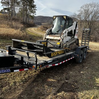 Ledebuhr Outdoor Services - a bobcat on a trailer - Tree Services Near Me - Houston, Minnesota Ledebuhr Outdoor Services - a bobcat on a trailer - Tree Services Near Me - Houston, Minnesota