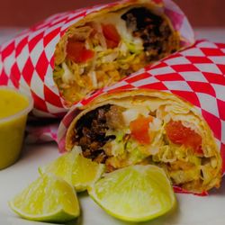 Mi Tienda Hernandez - The burrito includes meat, rice, beans, tomato, lettuce and cheese.