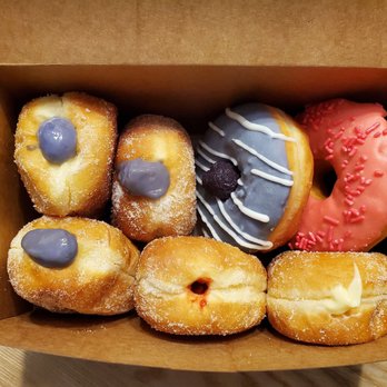 Starbread Bakery - 3 ube malasadas, 1 guava malasada, 1 custard  malasada, ube donut and pink glazed donut with sprinkles. - Bakeries Near Me - Las Vegas, Nevada