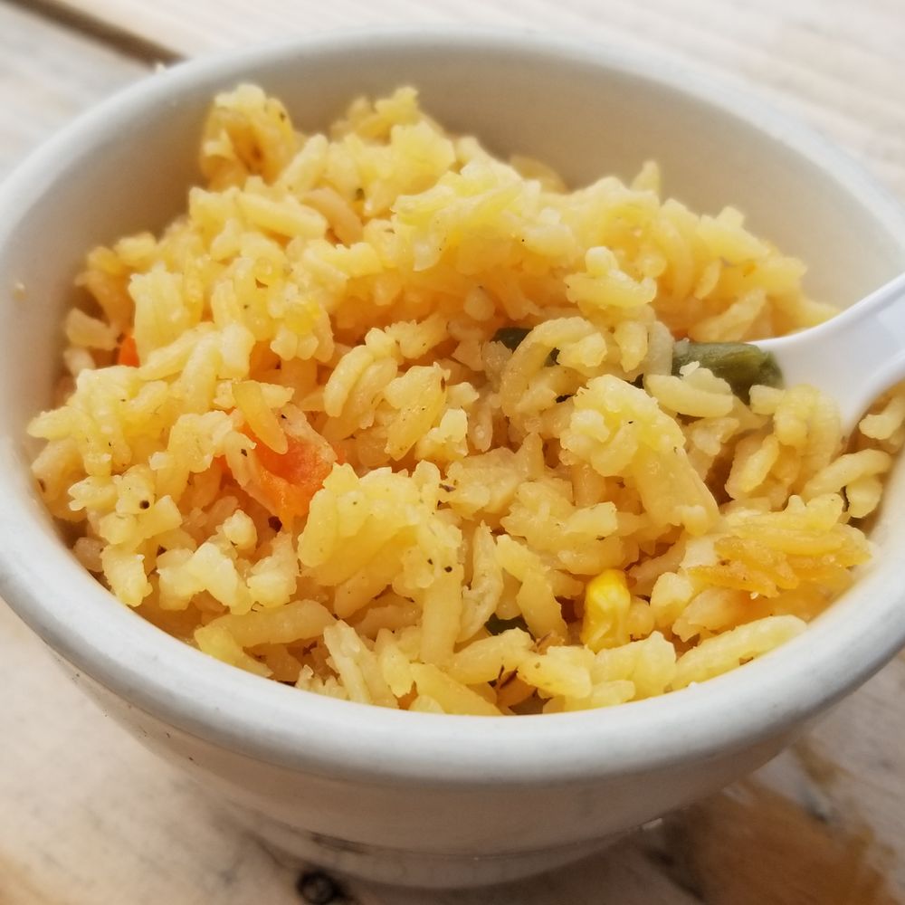 La Taquiza - a bowl of rice and a spoon - Mexican Near Me - Lexington, Kentucky La Taquiza - a bowl of rice and a spoon - Mexican Near Me - Lexington, Kentucky