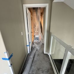 Pacific Insulation & Restoration - Corner guards taped, poly containment hung, hose routed -- all before the vacuum turns on. Protecting your home IS the job. (509) 879-0495