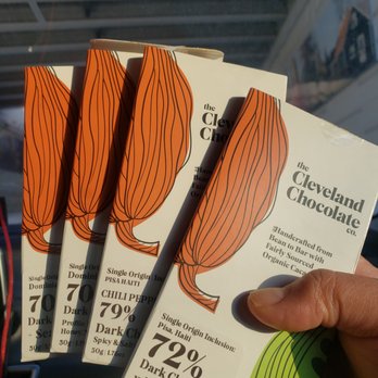 Cleveland Chocolate - a hand holding three packets of chocolate - Chocolatiers & Shops Near Me - Cleveland, Ohio Cleveland Chocolate - a hand holding three packets of chocolate - Chocolatiers & Shops Near Me - Cleveland, Ohio