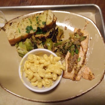 Urban Plates - Oven baked salmon entree with Brussels sprouts and macaroni and cheese - New American Near Me - Brea, California Urban Plates - Oven baked salmon entree with Brussels sprouts and macaroni and cheese - New American Near Me - Brea, California