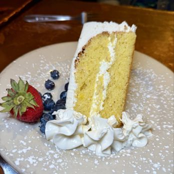 Girasole Restaurant - Lemon cake with lemon sponge soaked in limoncello and lemon curd whipped cream icing - Italian Near Me - Pittsburgh, Pennsylvania Girasole Restaurant - Lemon cake with lemon sponge soaked in limoncello and lemon curd whipped cream icing - Italian Near Me - Pittsburgh, Pennsylvania