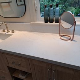 Custom quartz countertop with subtle veins and honed finish for a 60" base cabinet.