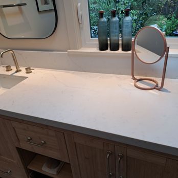 SurfaceTopia Stone Countertops & Tile - Custom quartz countertop with subtle veins and honed finish for a 60" base cabinet. - Countertop Installation Near Me - San Mateo, California