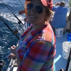 Amick's Deep Sea Fishing - Happy lady out on the water