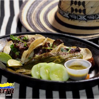 Mi Tierra Restaurante - Tacos: Wheat tortilla folded or rolled around a filling beef or pork. Tacos de Carne o Cerdo - Colombian Near Me - Naples, Florida Mi Tierra Restaurante - Tacos: Wheat tortilla folded or rolled around a filling beef or pork. Tacos de Carne o Cerdo - Colombian Near Me - Naples, Florida