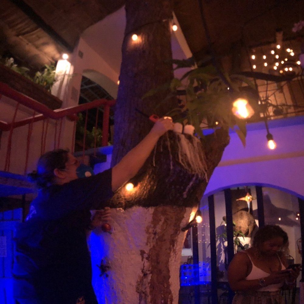 Merida Grill - The owner lighting up the candles. - Mexican Near Me - Puerto Vallarta, JAL