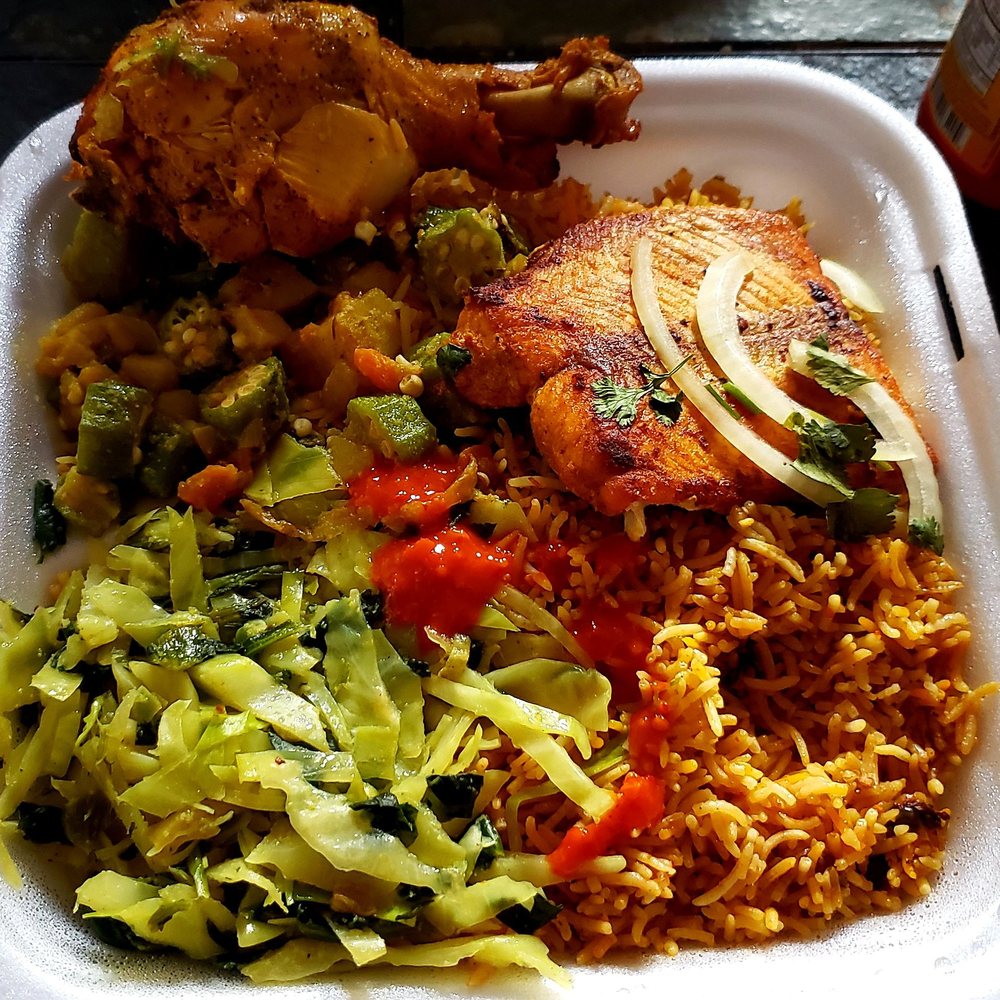 Mogadishu Restaurant - We ordered fish and chicken and it came with seasoned rice and veggies. So yummy! - African Near Me - Chicago, Illinois