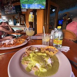 Tarasco Style Eggs Fried eggs on a corn tortilla with grilled chicken covered in creamy poblano sauce. Refried beans and has browns Tarasco Style Eggs Fried eggs on a corn tortilla with grilled chicken covered in creamy poblano sauce. Refried beans and has browns