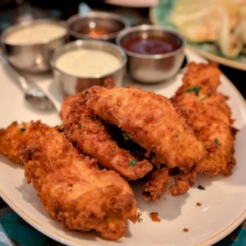 Delilah - Chicken tenders with hot honey, ranch and barbecue sauce - New American Near Me - Las Vegas, Nevada Delilah - Chicken tenders with hot honey, ranch and barbecue sauce - New American Near Me - Las Vegas, Nevada