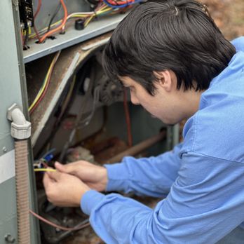 Air Force Air Conditioning & Heating - Technician replacing damaged control wire - Heating & Air Conditioning/HVAC Near Me Air Force Air Conditioning & Heating - Technician replacing damaged control wire - Heating & Air Conditioning/HVAC Near Me