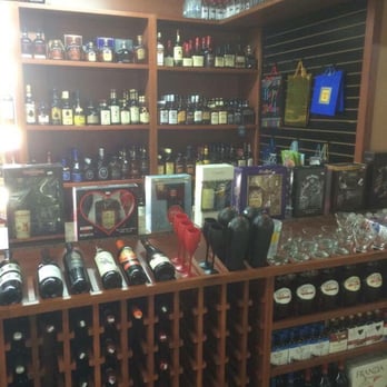 Liquor Wheel 2 - a wine rack with bottles of wine - Beer, Wine & Spirits Near Me - Phoenix, Arizona