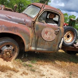 a rusted truck with a flat bed a rusted truck with a flat bed