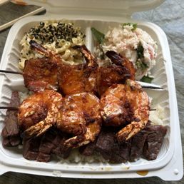Kalbi and shrimp plate with krab and mac salad as sides Kalbi and shrimp plate with krab and mac salad as sides