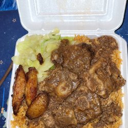Africa & Caribbean Cuisine - Oxtail and stew with cabbage, plantains and jolloff rice