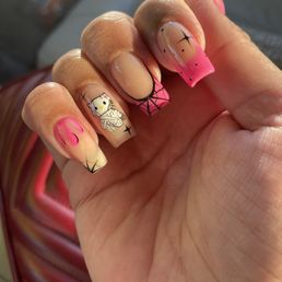 Hello kitty Halloween nails hand painted by Tony