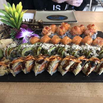 Ryo Sushi - From front to back: Godzilla roll, Green dragon roll, twins roll, Volcano roll - Sushi Bars Near Me - Chicago, Illinois Ryo Sushi - From front to back: Godzilla roll, Green dragon roll, twins roll, Volcano roll - Sushi Bars Near Me - Chicago, Illinois