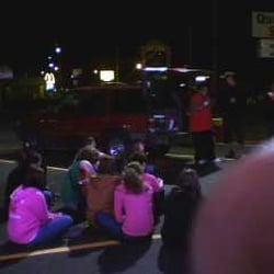Grand opening. Rapper singing in parking lot.