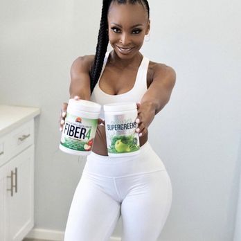 Nutrishop - a woman holding two cups of yogurt - Vitamins & Supplements Near Me - Concord, California Nutrishop - a woman holding two cups of yogurt - Vitamins & Supplements Near Me - Concord, California
