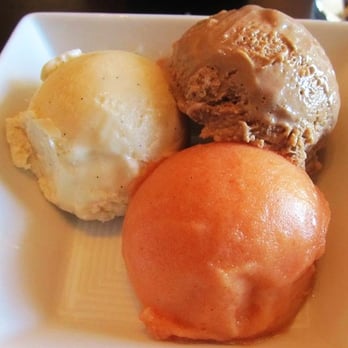NoMI - Tahitian Vanilla Bean ice cream, stout milk chocolate ice cream & blood orange sorbet - Bars Near Me - Chicago, Illinois