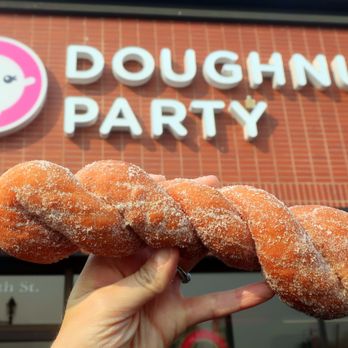 Doughnut Party - a hand holding three doughnuts - Donuts Near Me - Edmonton, Alberta Doughnut Party - a hand holding three doughnuts - Donuts Near Me - Edmonton, Alberta