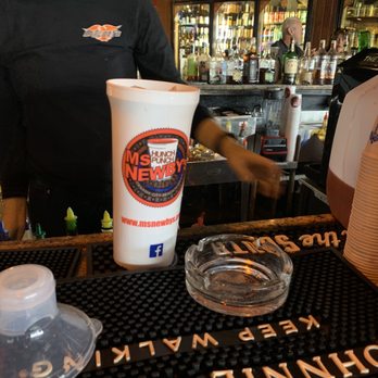 Ms Newby's Liquors - a man pouring a drink - Beer, Wine & Spirits Near Me - Panama City, Florida Ms Newby's Liquors - a man pouring a drink - Beer, Wine & Spirits Near Me - Panama City, Florida
