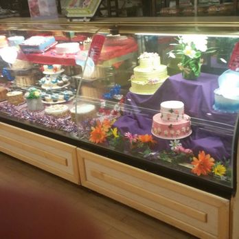 Tops Friendly Markets - a display of cakes and cupcakes - Grocery Near Me - Batavia, New York